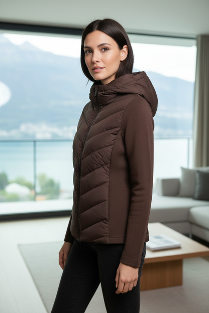Native Swiss woman wearing the brown hooded hybrid jacket in Lucerne