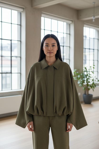 Native Swiss woman wearing the army green oversized jacket in Zurich