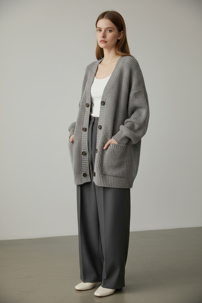Gray loose knit cardigan sweater, full-body angled view on model