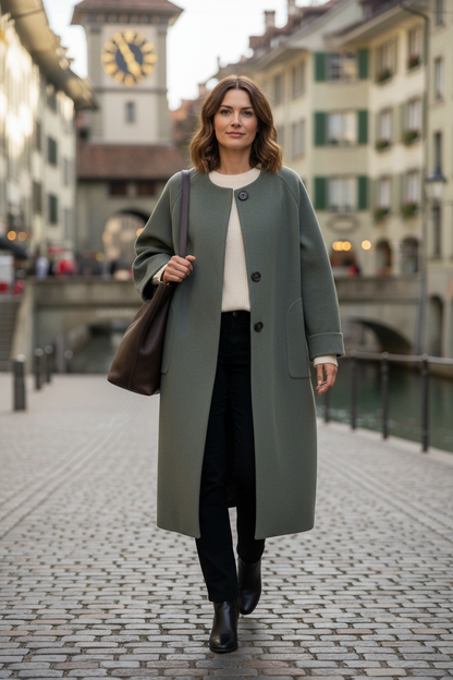 Native Swiss woman wearing gray green oversized coat in Bern